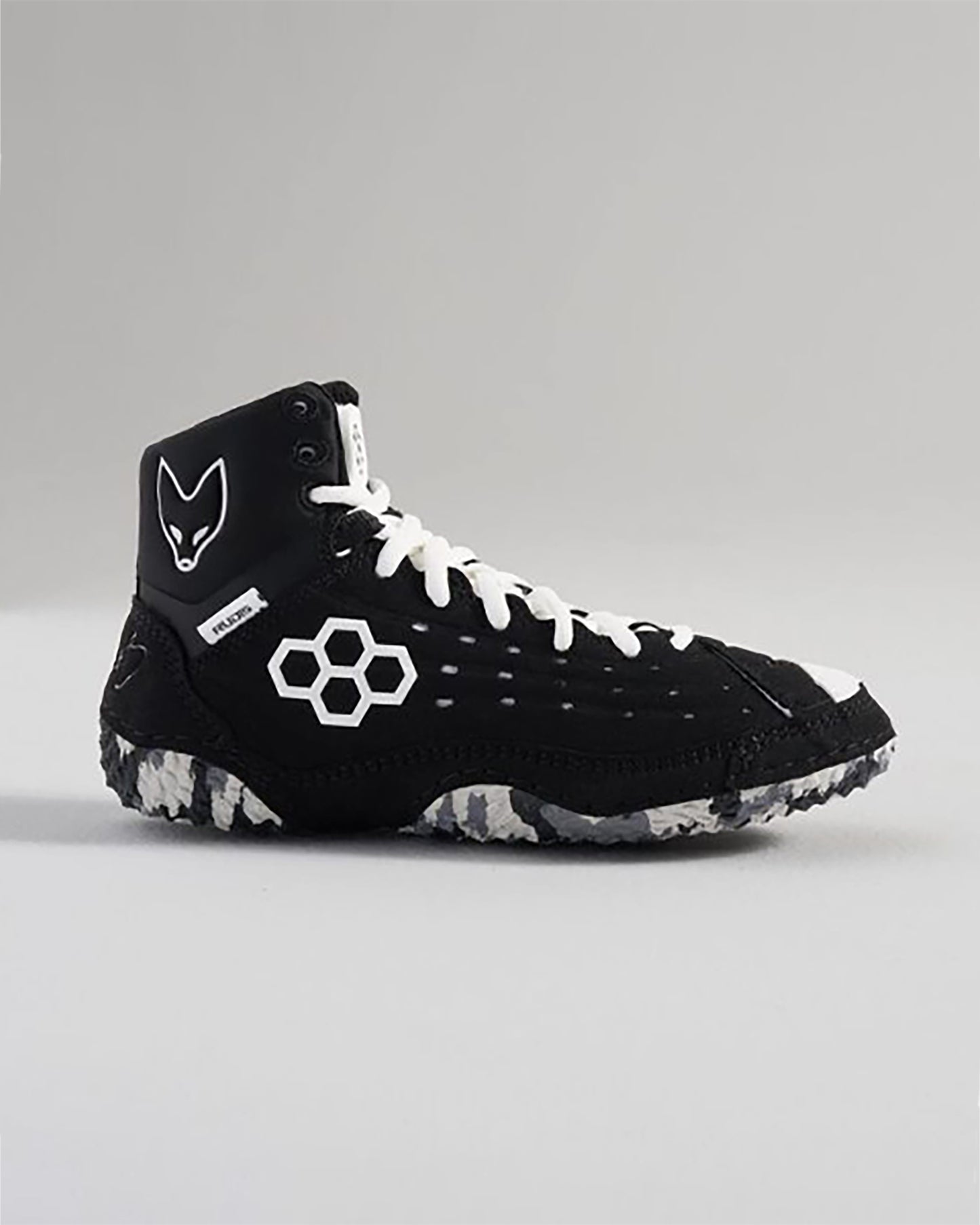 This image showcases a modern black high-top sneaker featuring distinctive design elements and textured soles for grip