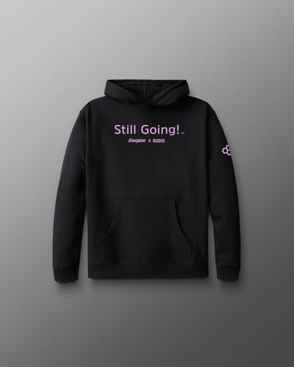 Black hoodie with 'Still Going!' text on a gray background