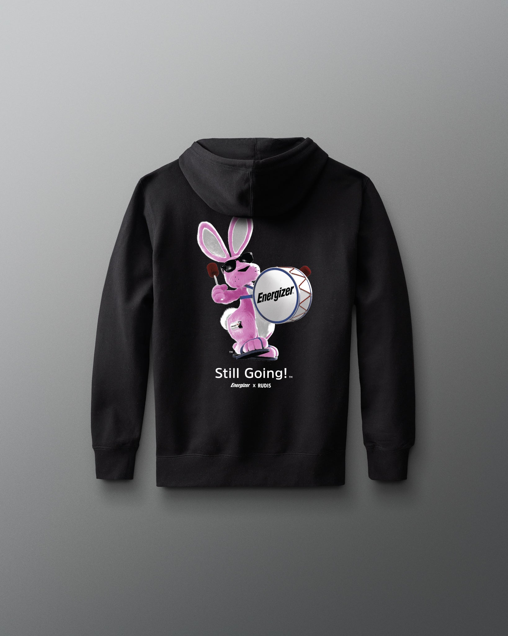 Black hoodie with a cartoon character and text on the back against a gray background