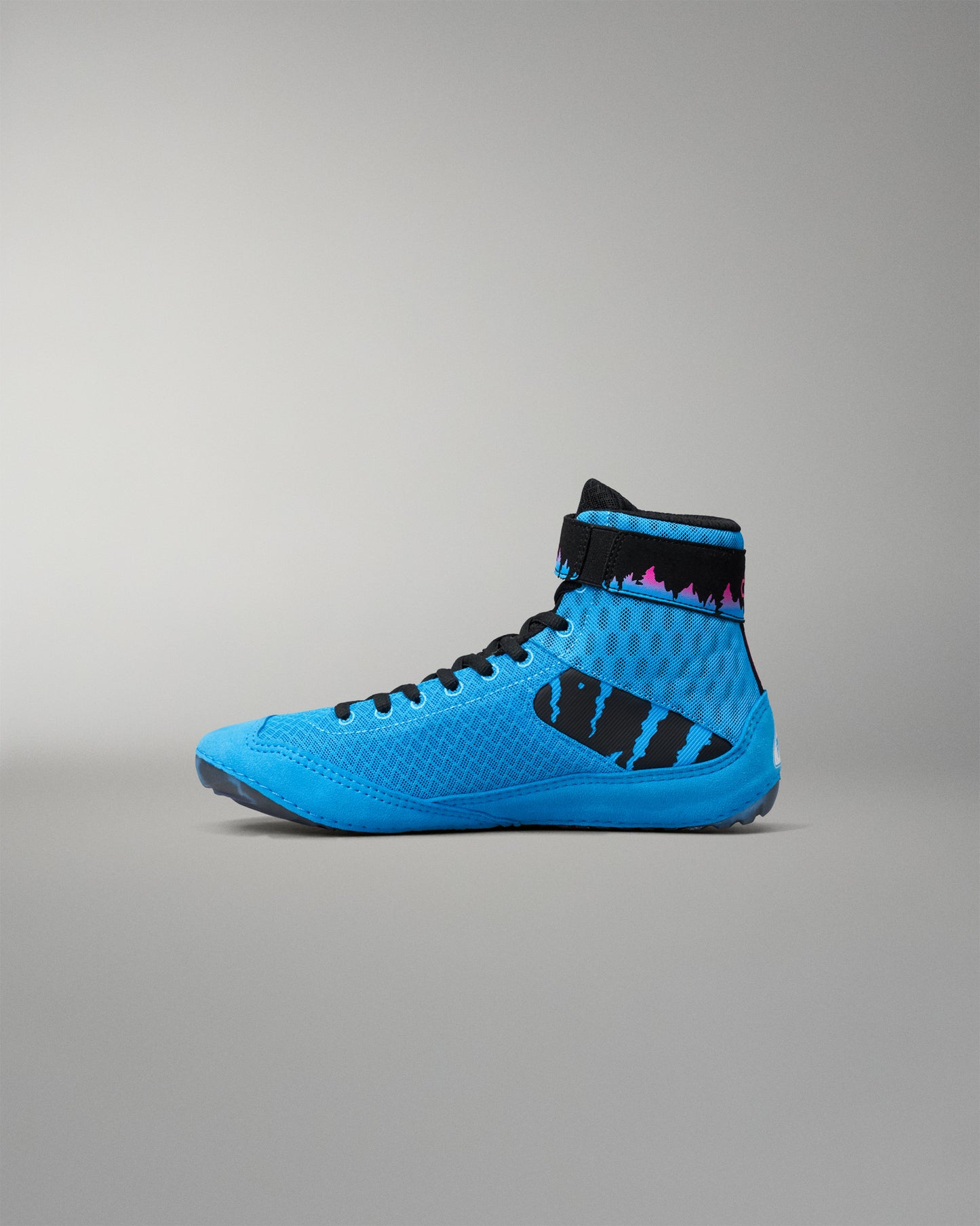 A bright blue high-top wrestling shoe with black accents, including the laces and a black side graphic, photographed from the side profile against a neutral gray background.