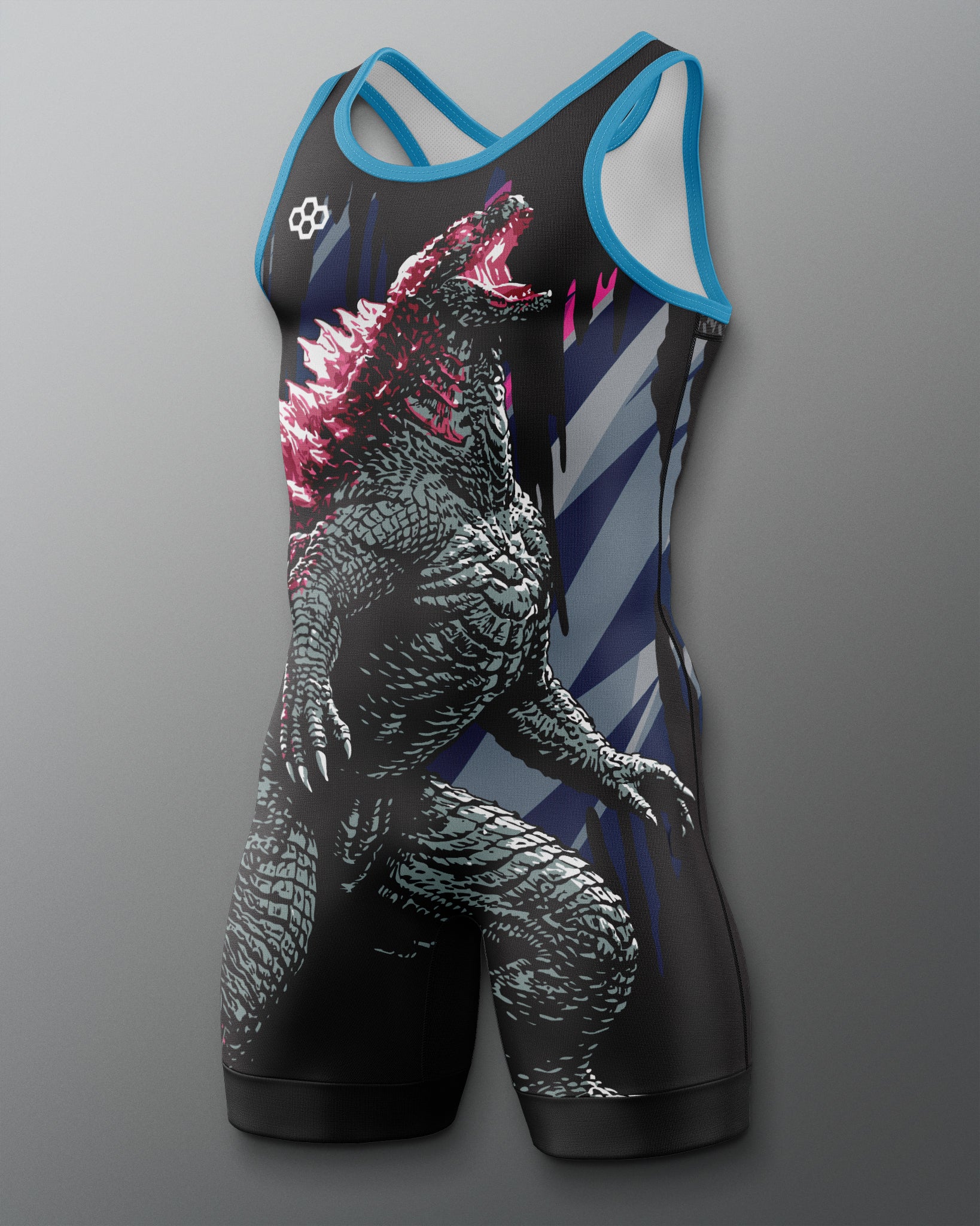 A sleeveless wrestling singlet with a large Godzilla graphic print, featuring a black body with blue trim, white diagonal stripes on the sides, and pink accents on the creature's back, shown against a gray gradient background.