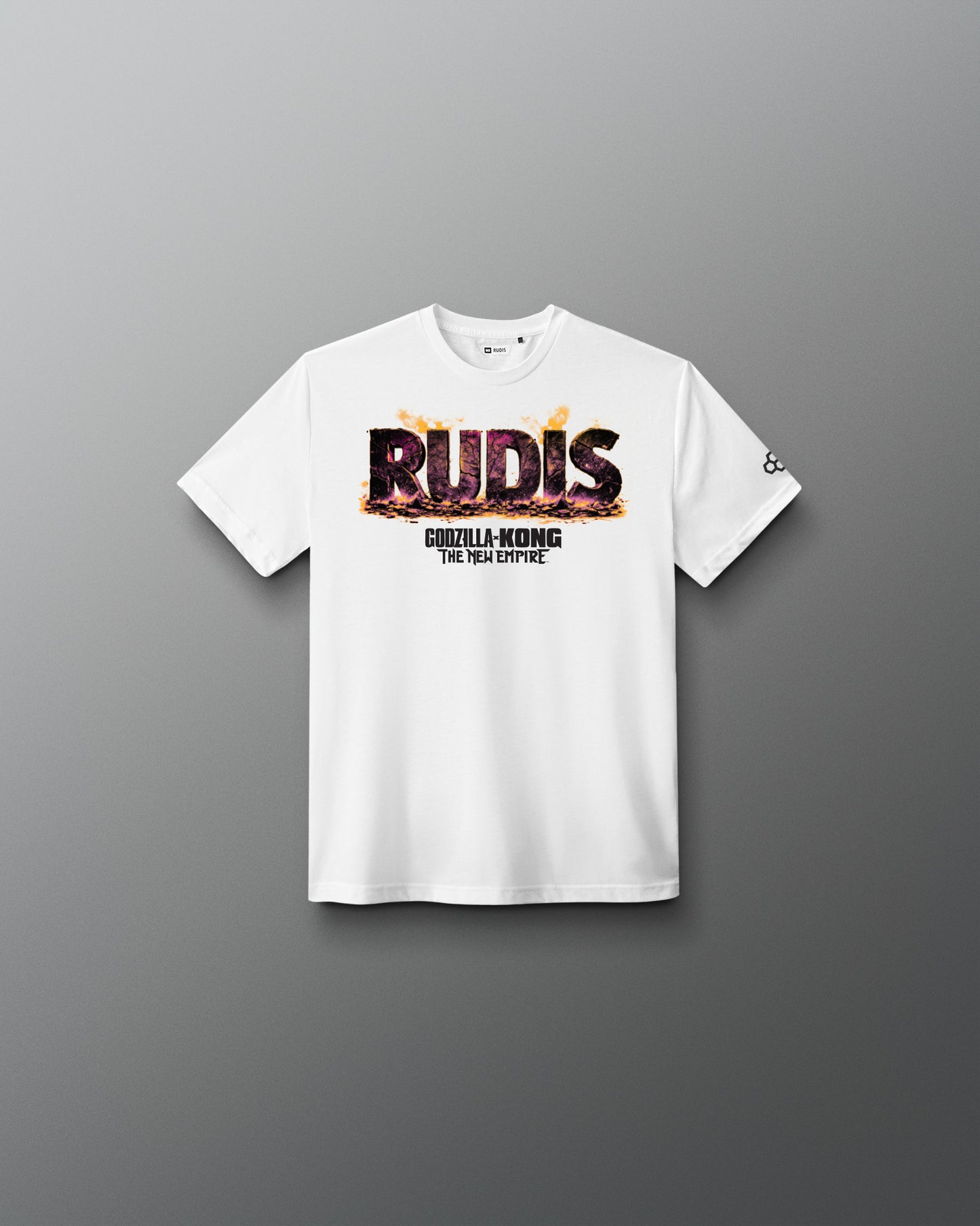 A white short-sleeve crewneck t-shirt with a graphic on the chest reading 'RUDIS' in a fiery textured font and 'GODZILLA-KONG THE new empire underneath, displayed on a clean gray gradient background.