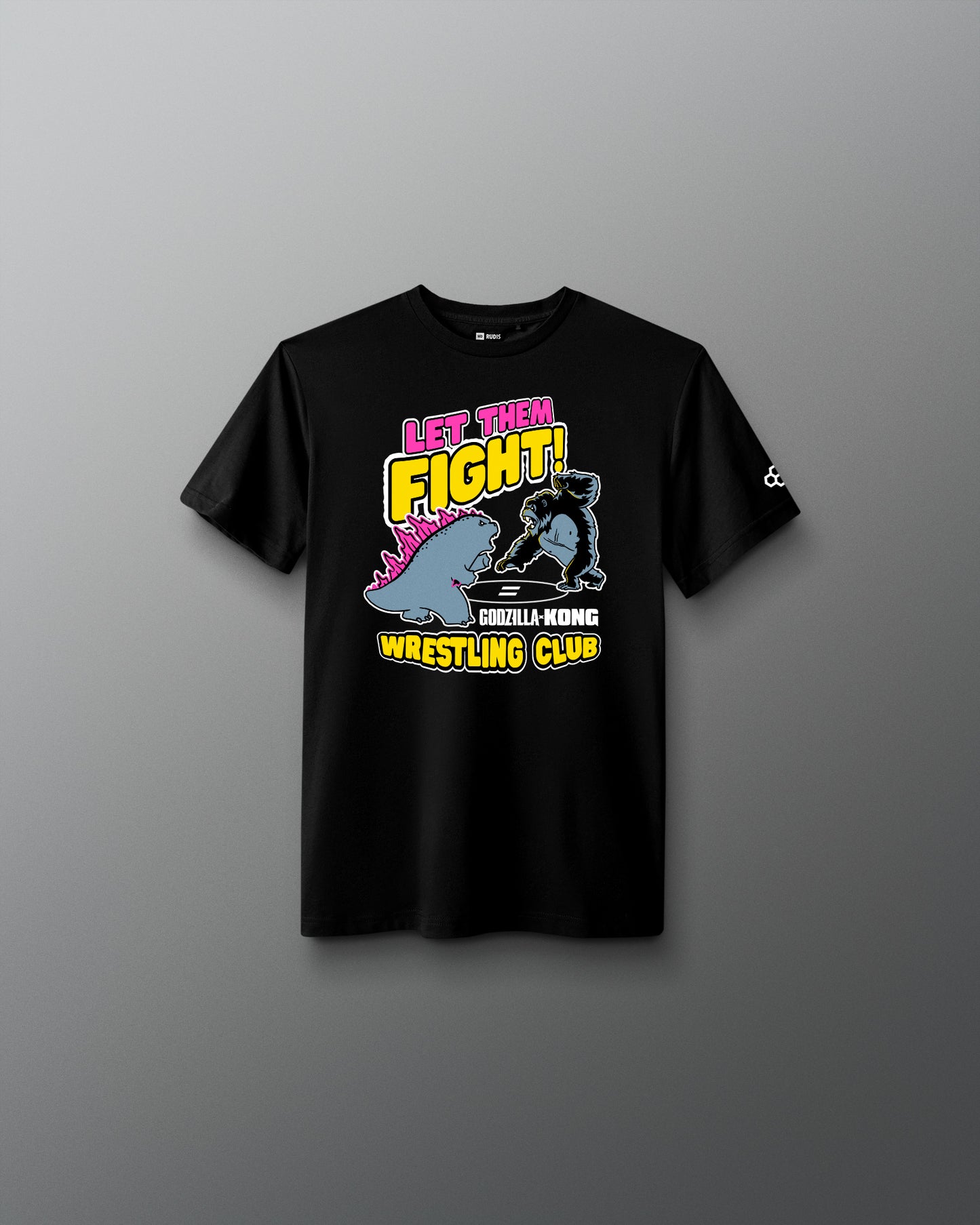A black short-sleeve t-shirt with a colorful graphic on the front that reads 'LET THEM FIGHT! GORILLA WRESTLING CLUB' with a cartoon gorilla and pink, yellow, and blue details, shown against a dark gray gradient background.