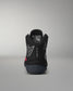 Black wrestling shoe with visible branding on a gray background