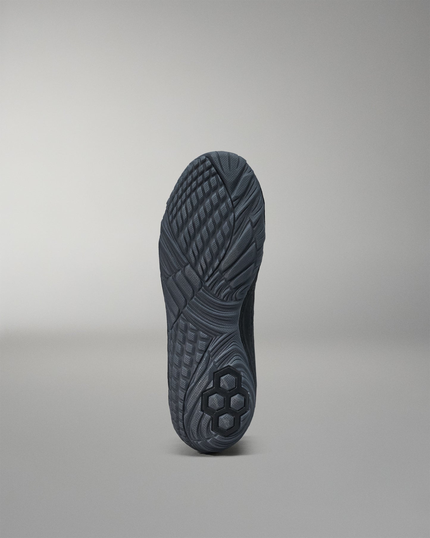 Black sole of a shoe on a gray background