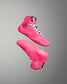 Pink high-top wrestling shoe with white laces on a gray background