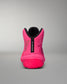 Pink wrestling shoe with black sole on a gray background