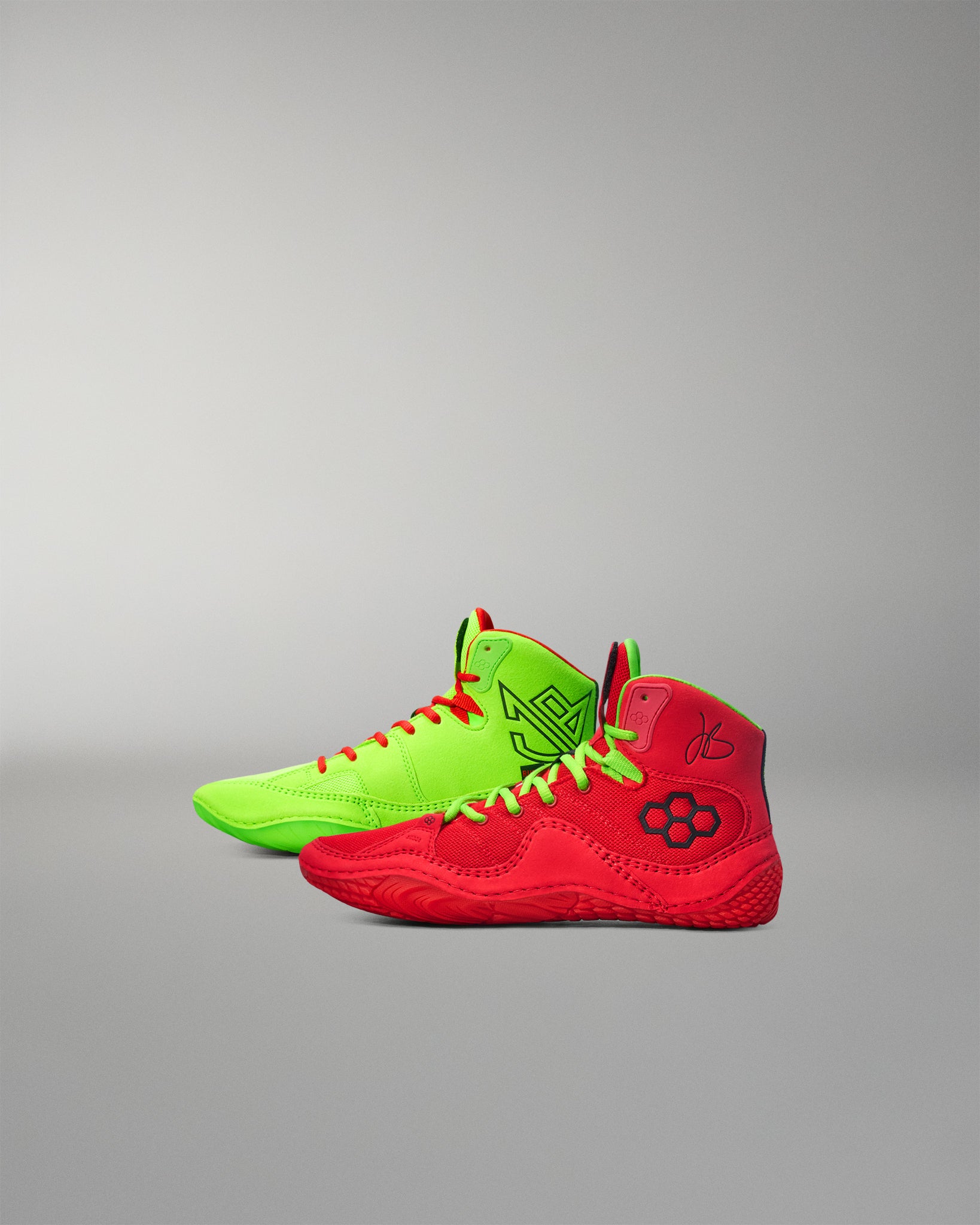 Red and green Wrestling shoes on a gray background