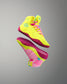 Neon yellow and pink high-top sneakers on a gray background
