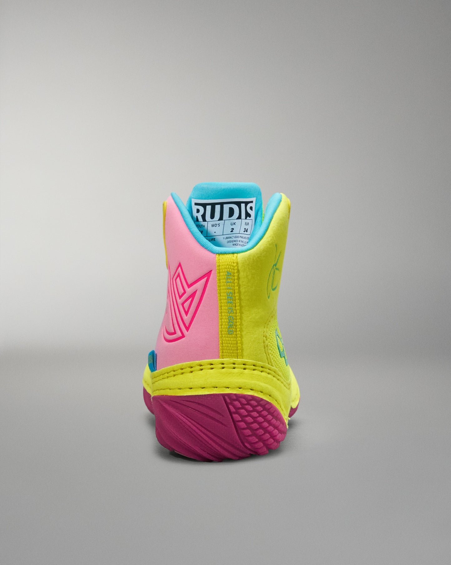 Colorful Wrestling shoe with 'Rudis' branding on a gray background