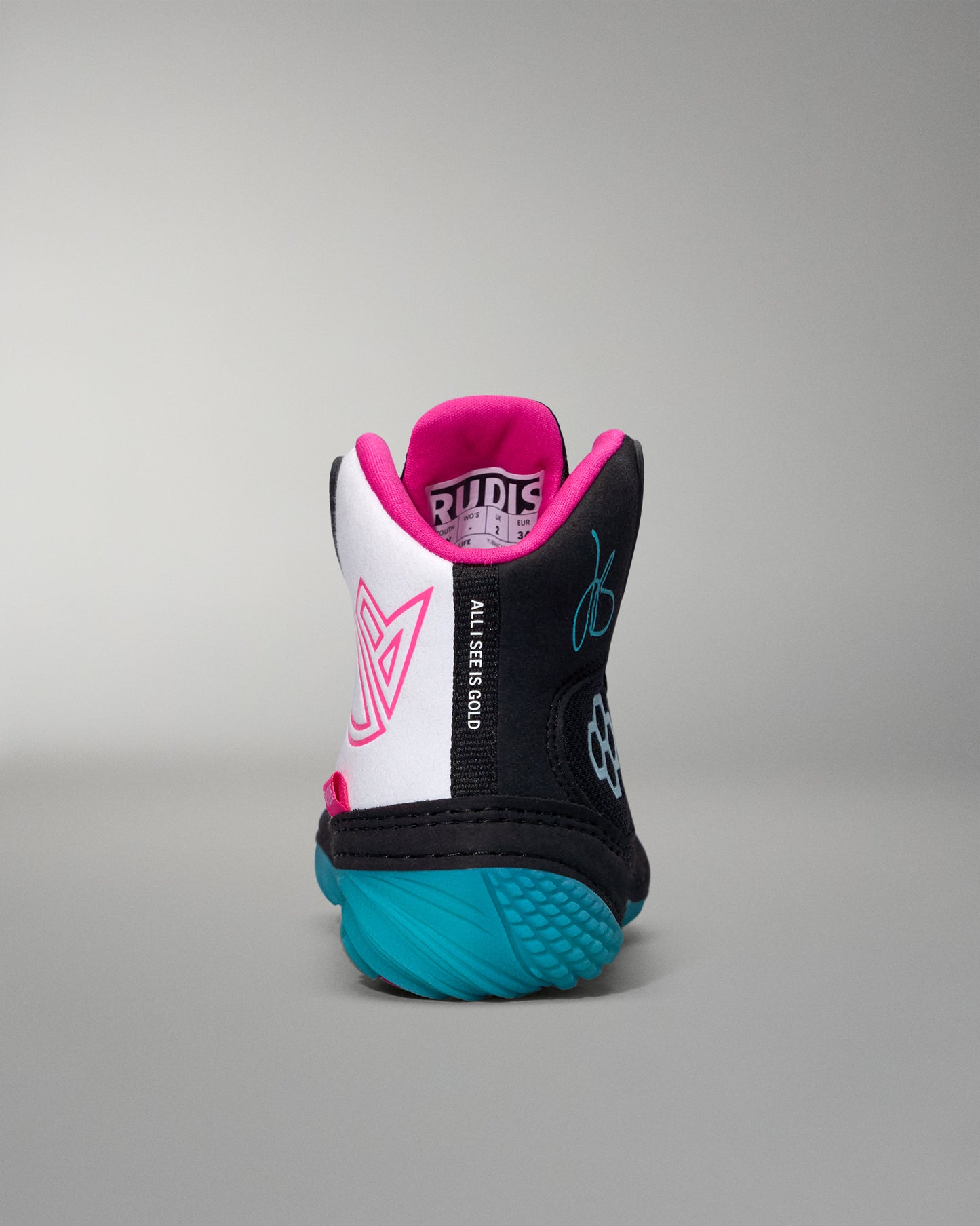 wrestling shoe with pink and black accents on a gray background