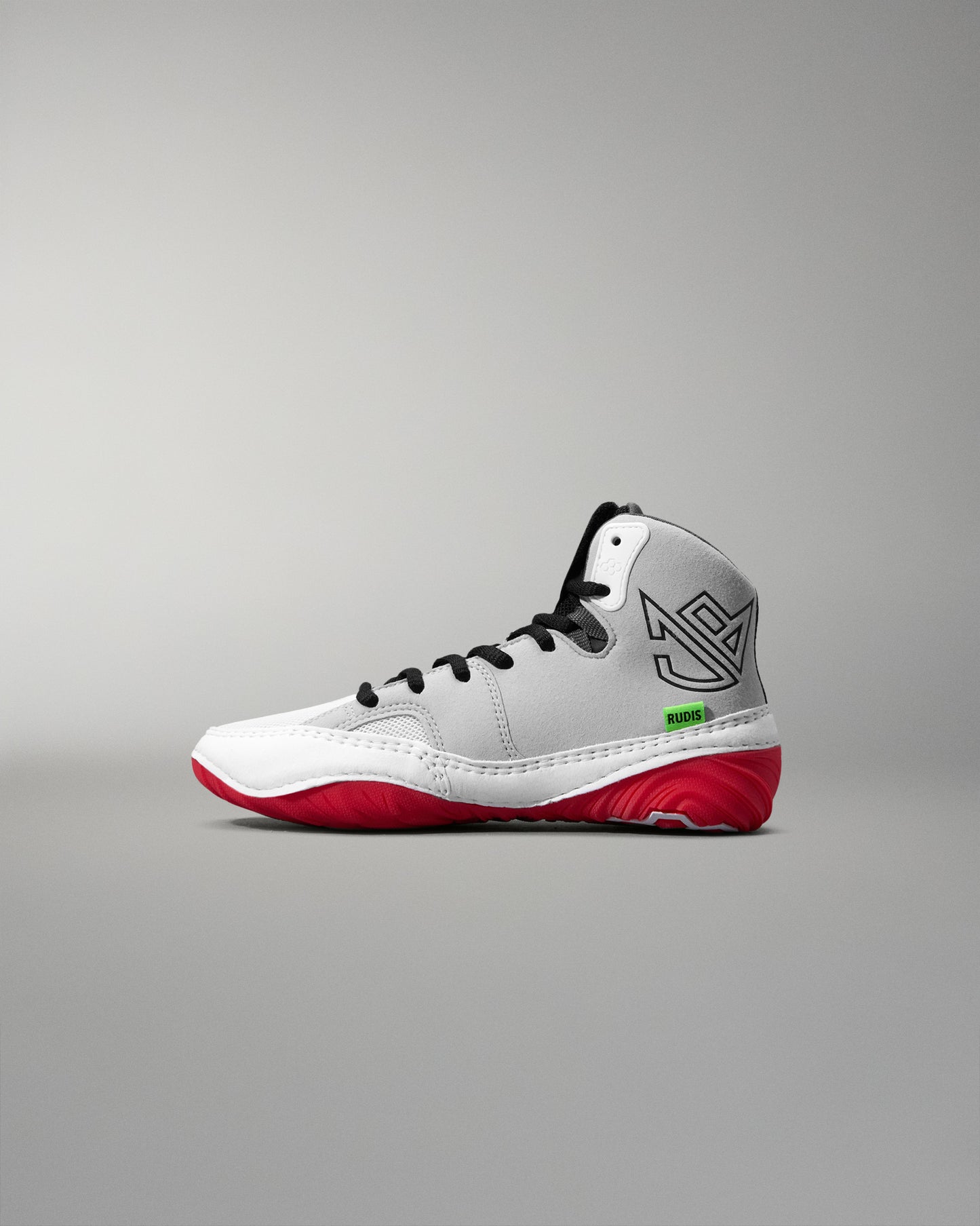 White wrestling shoe with red soles on a gray background