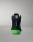 Black Wrestling shoe with green sole on a gray background