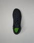 Black Wrestling shoe with green sole on a light gray background