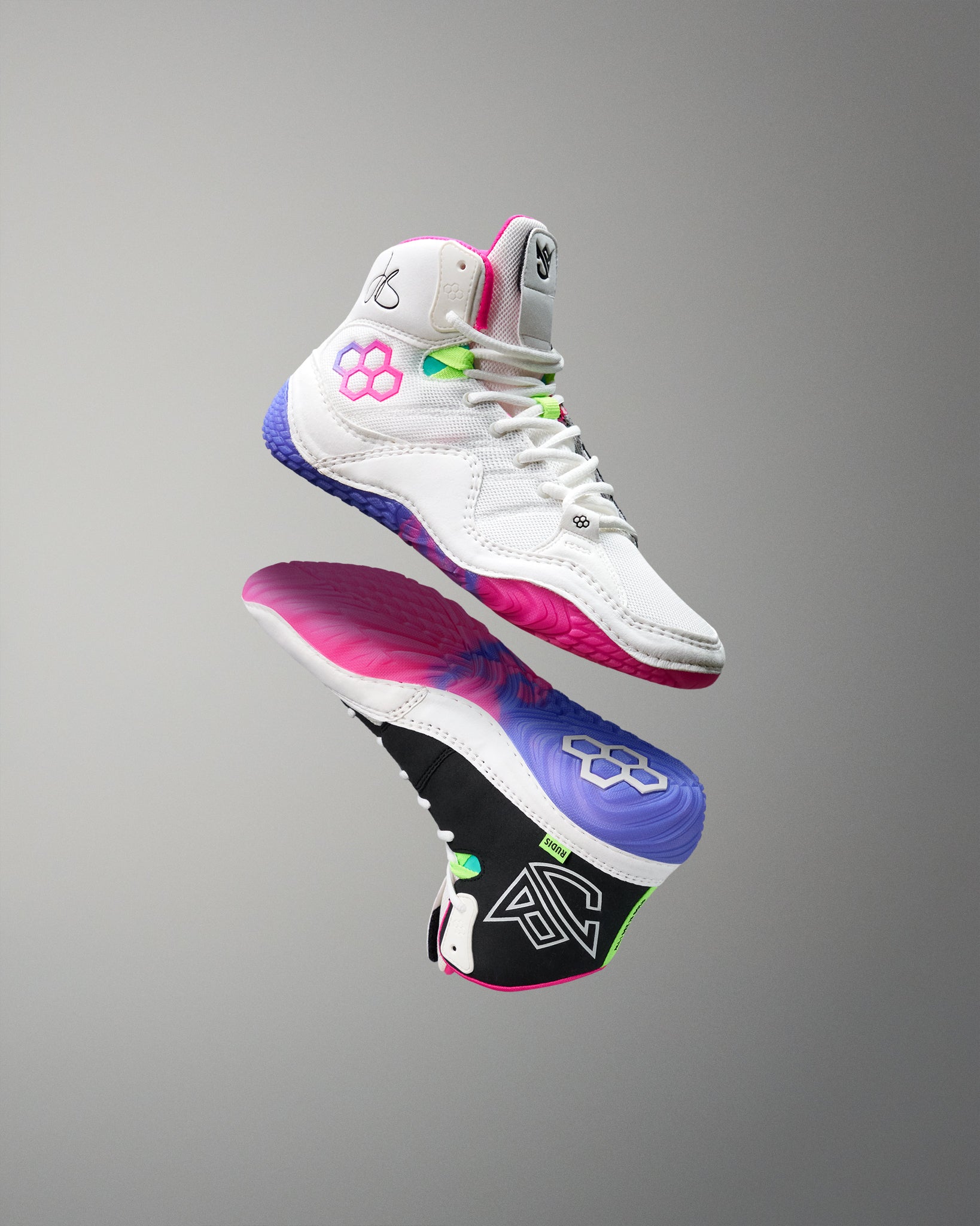 Colorful wrestling shoes with a gray background