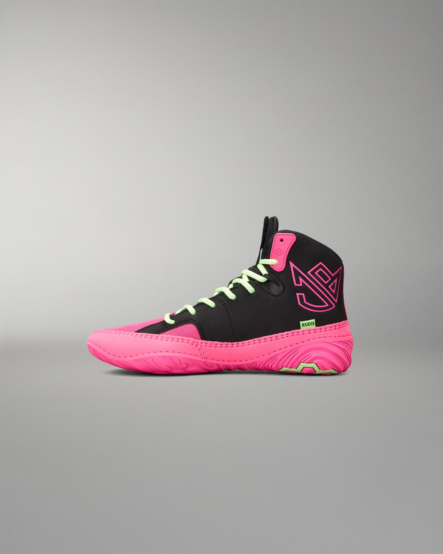 A high-top athletic wrestling shoe in black and neon pink, featuring lime green laces and a small green tag near the heel, shown against a neutral gray background.