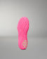 A bright pink wrestling shoe sole shown upright against a neutral gray gradient background, featuring a textured tread pattern and a small neon yellow-green geometric logo near the heel.