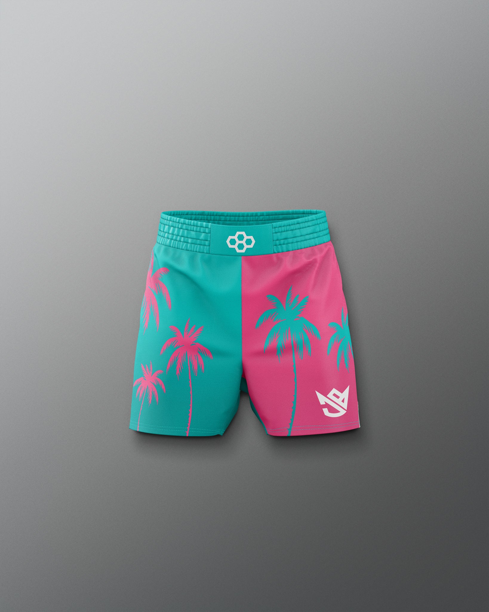 Two-tone shorts with palm tree design on a gray background