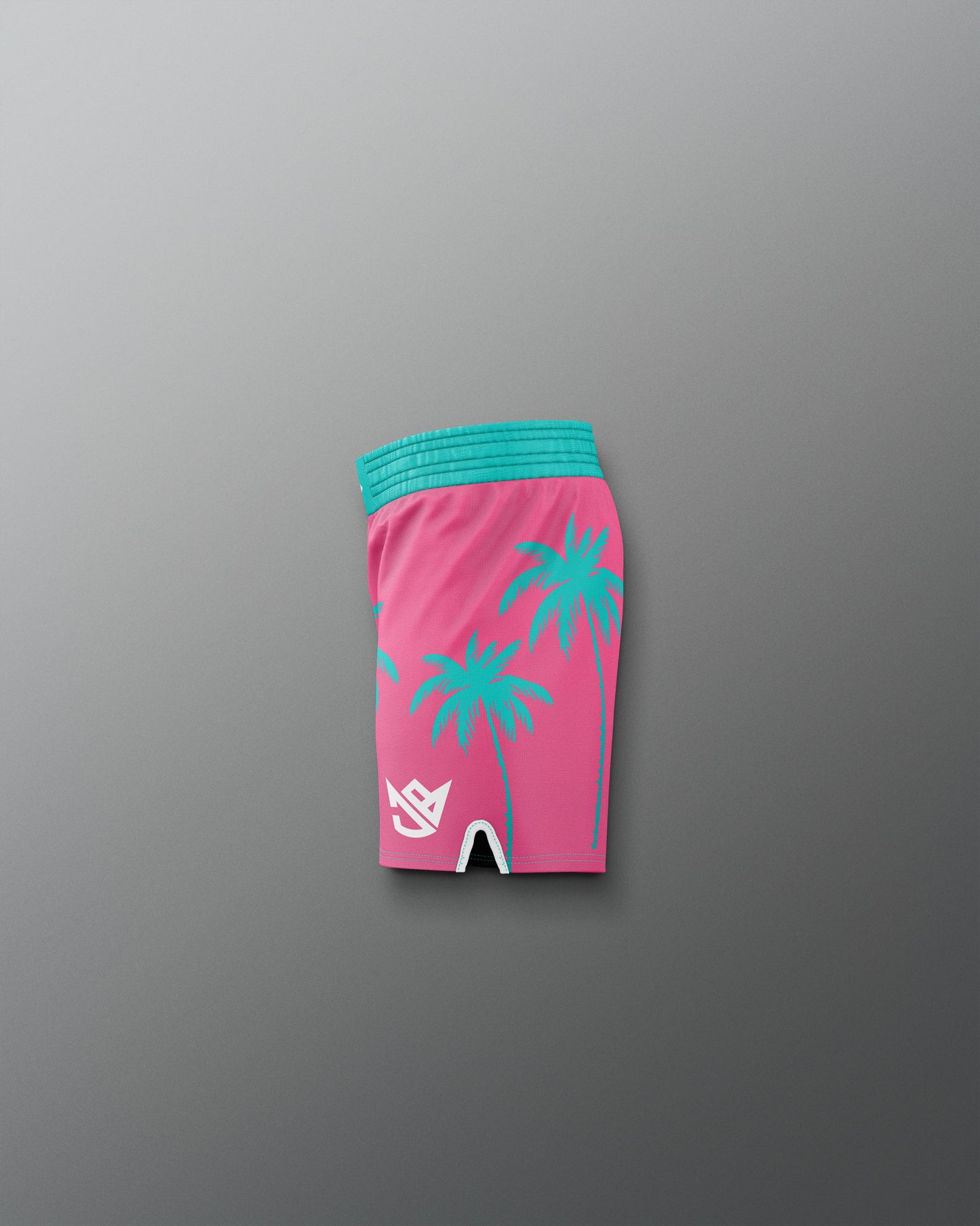 Pink shorts with green palm tree patterns and a blue waistband on a gray background