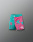 Two-tone pink and teal shorts with palm tree designs on a gray background