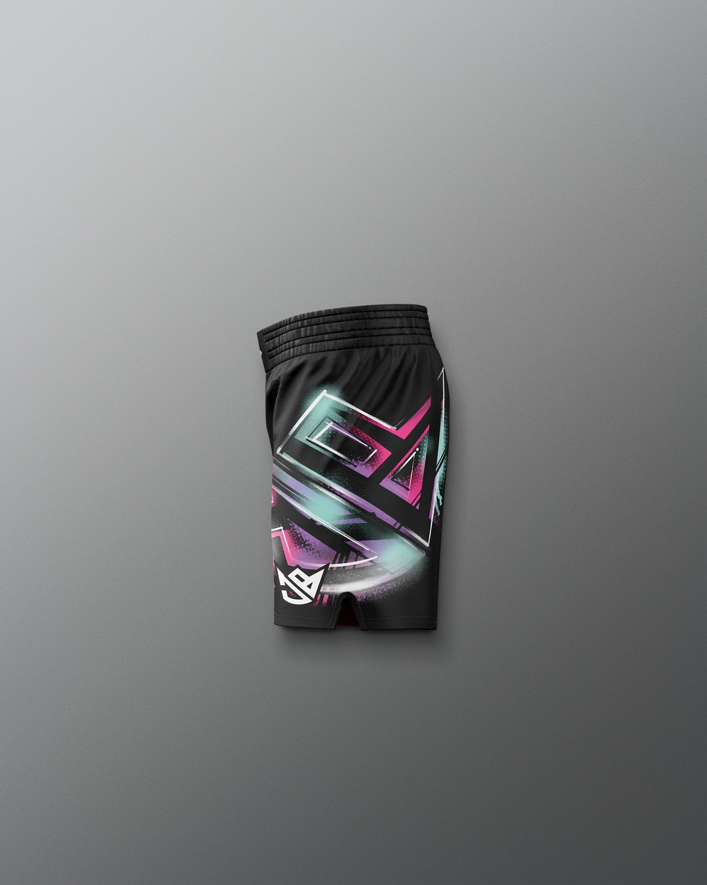 Black shorts with colorful geometric pattern on a gray background