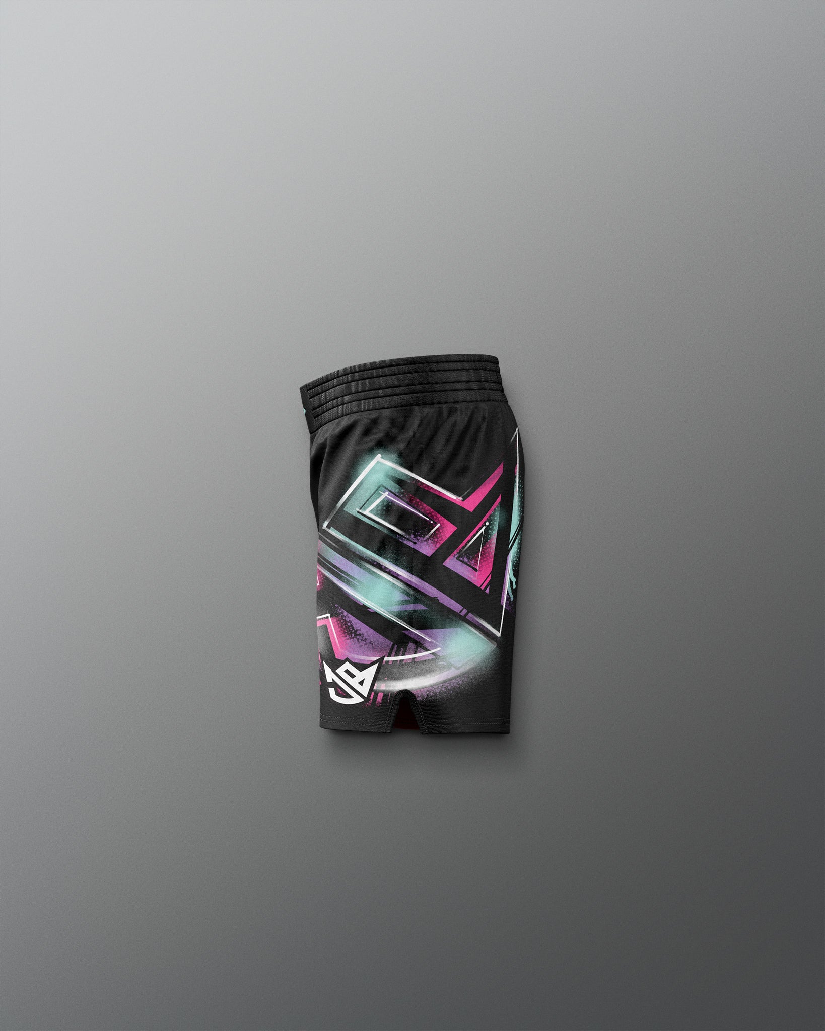 Black shorts with colorful geometric pattern on a gray background