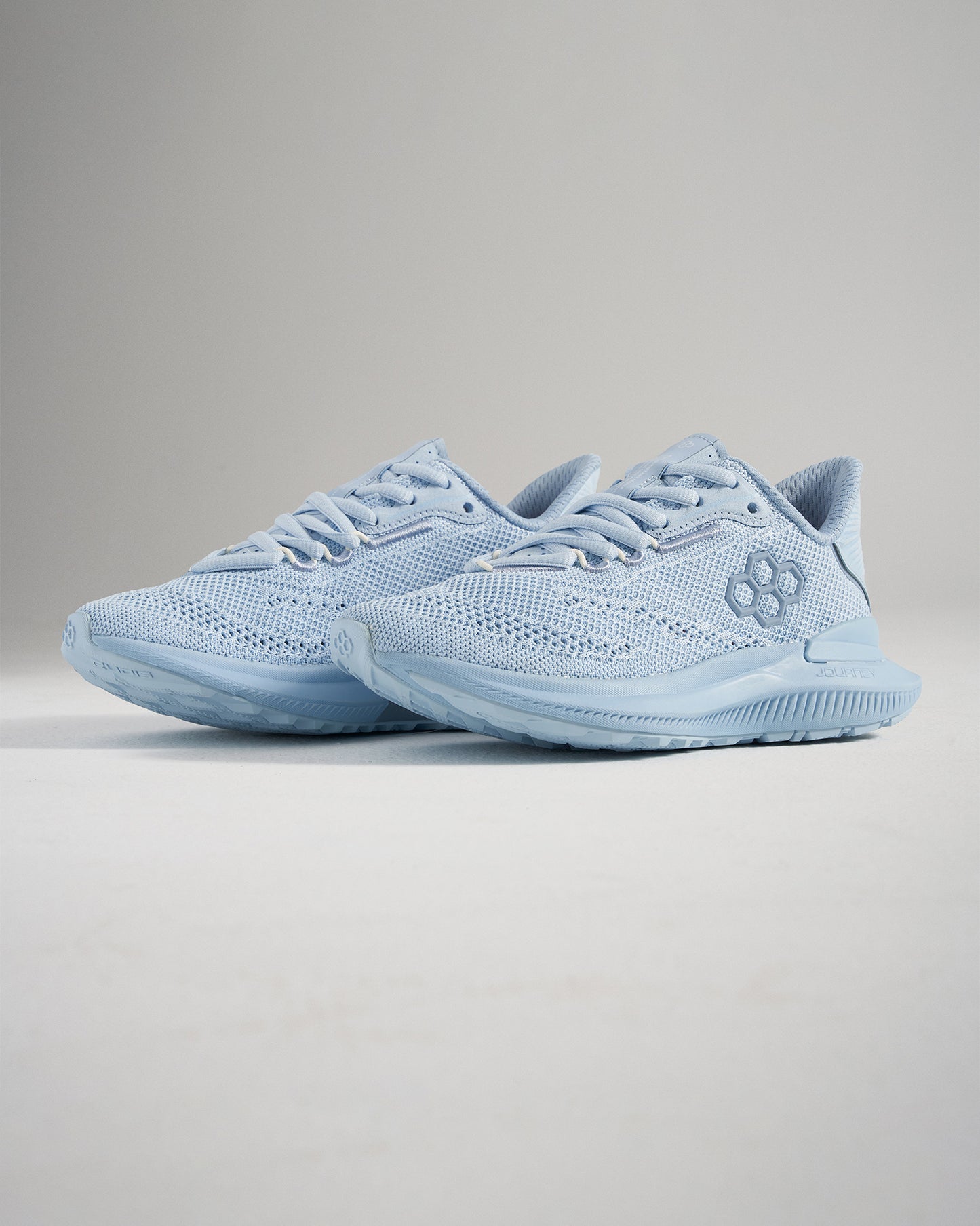 These light blue running shoes showcase a breathable mesh upper flexible sole and a stylish modern design for both athletic and casual wear