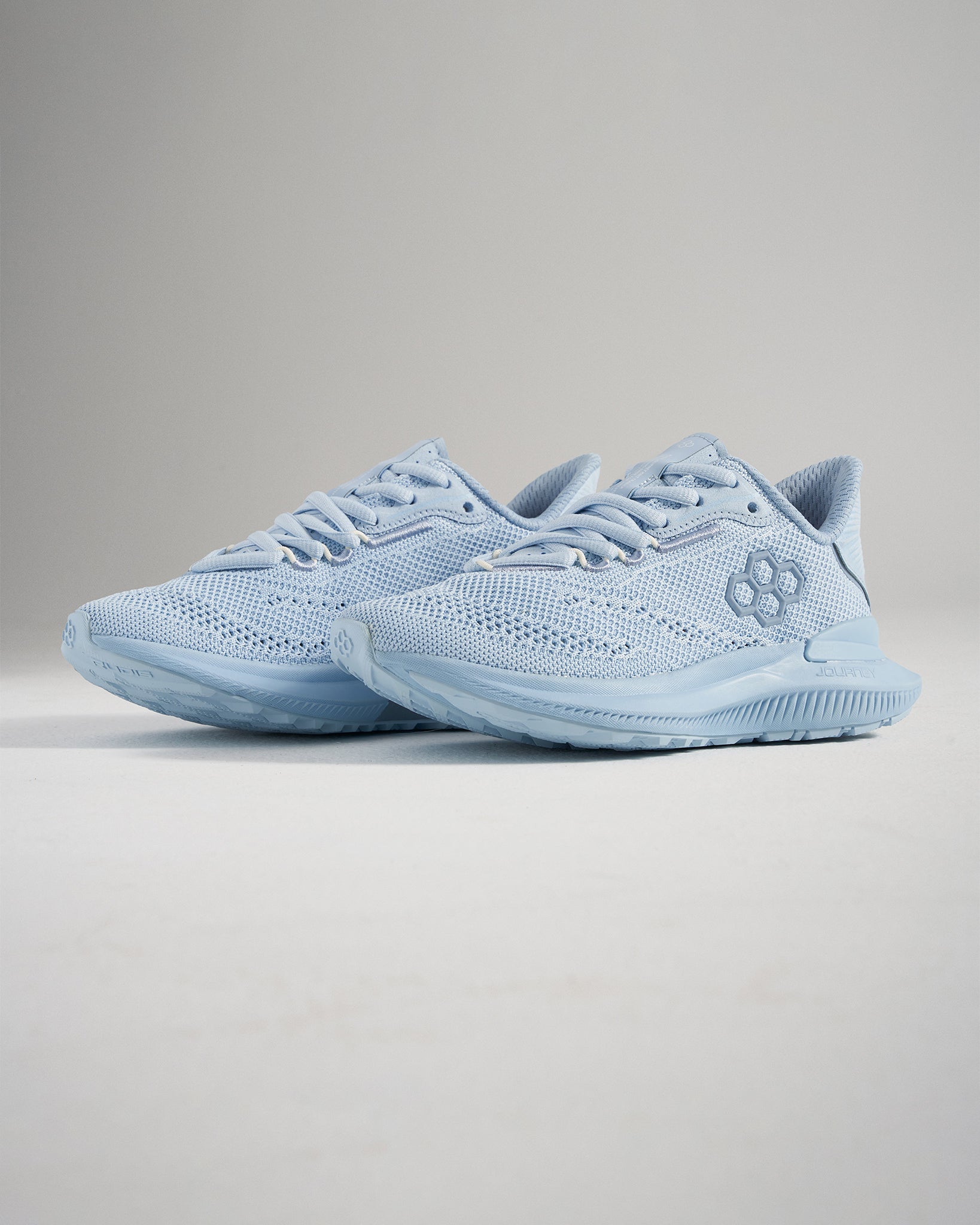 These light blue running shoes showcase a breathable mesh upper flexible sole and a stylish modern design for both athletic and casual wear