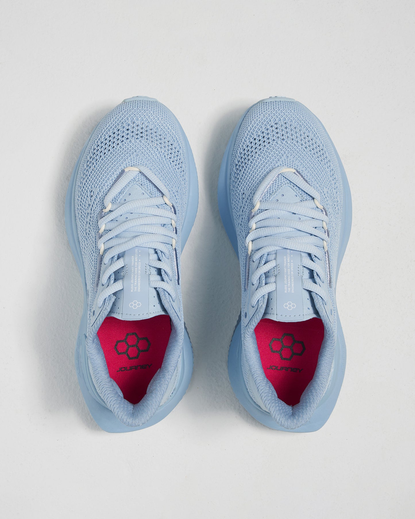 A pair of light blue athletic shoes featuring a breathable mesh upper and vibrant pink insoles ideal for running and comfortable wear