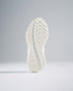 A close-up view of a sleek white athletic shoe sole featuring a detailed tread pattern for enhanced grip and performance