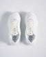 A pair of modern white athletic shoes featuring breathable mesh uppers and comfortable insoles designed for both style and performance