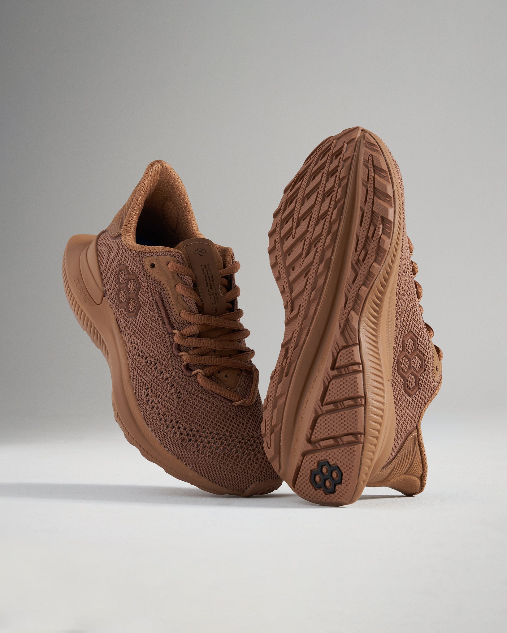 A pair of stylish brown running shoes featuring a breathable mesh upper and a textured sole designed for optimal grip and comfort