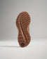 A close-up view of the sole of a running shoe featuring a textured surface designed for traction and grip with a shoe design that indicates durability