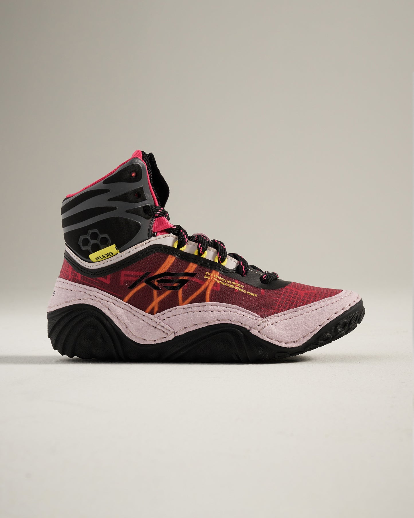 A modern pair of high-top athletic shoes featuring a vibrant red and black design reinforced ankle support and textured grip soles ideal for both performance and style
