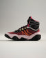 A stylish high-top athletic shoe featuring a bold red and black design with unique yellow and orange accents ideal for sports and casual wear
