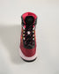 A modern athletic shoe featuring a vibrant red and pink design with a high-top structure breathable mesh upper and durable rubber sole