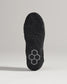 A close-up view of a black athletic shoes sole showcasing detailed tread patterns and a unique hexagonal design feature
