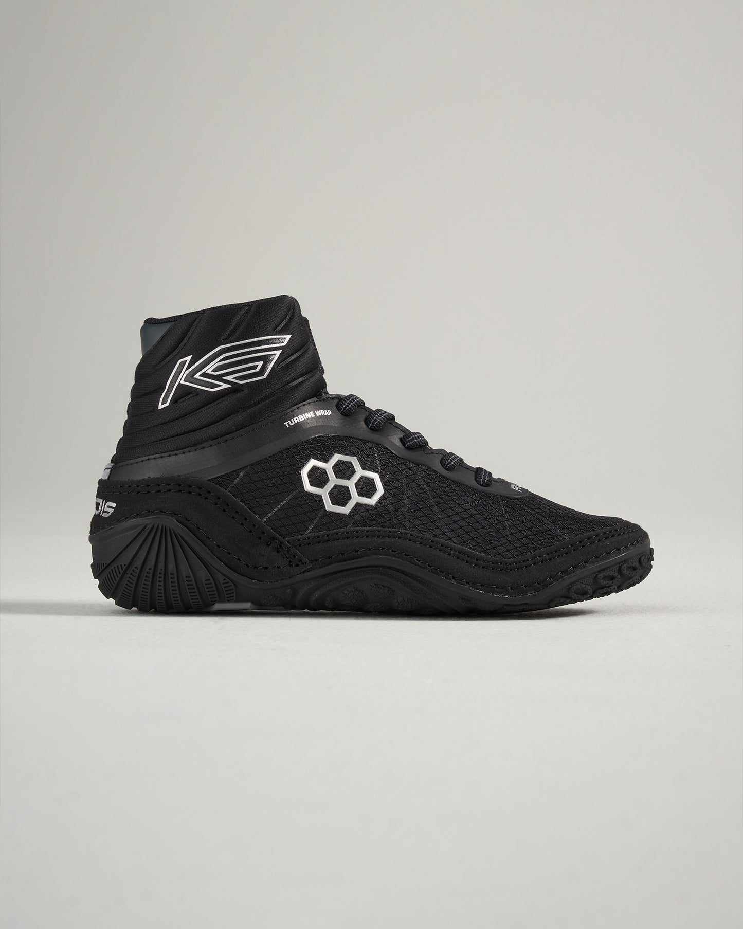 Black high-top athletic shoes designed for performance featuring a mesh upper and textured rubber sole for grip