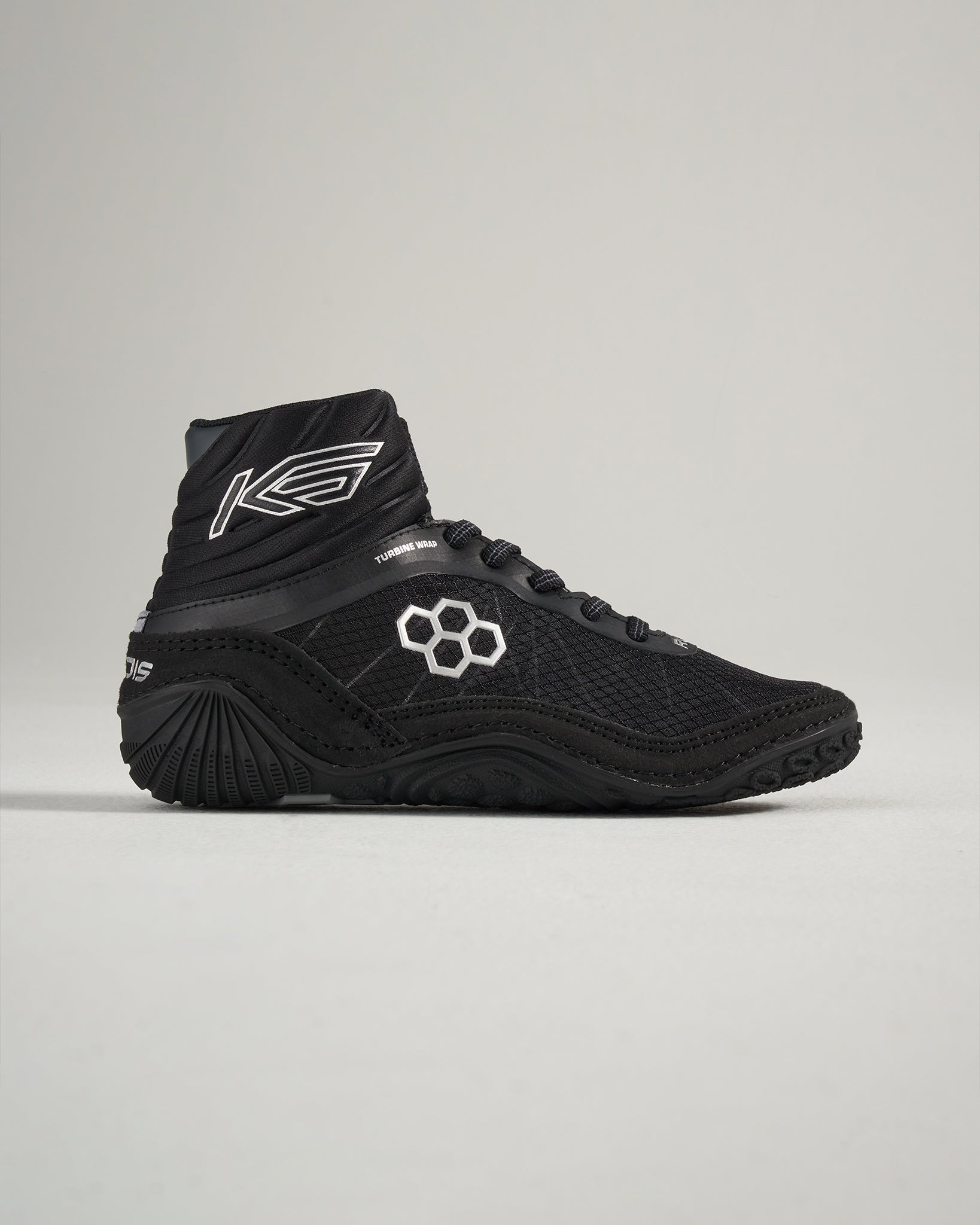 Black high-top athletic shoes designed for performance featuring a mesh upper and textured rubber sole for grip
