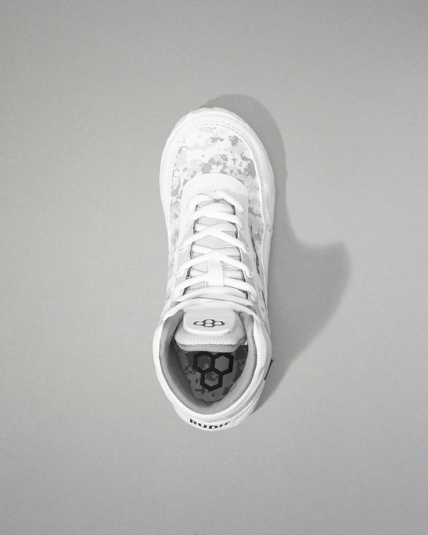 White wrestling shoe on a gray background