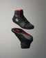 Black and red wrestling shoes on a gray background