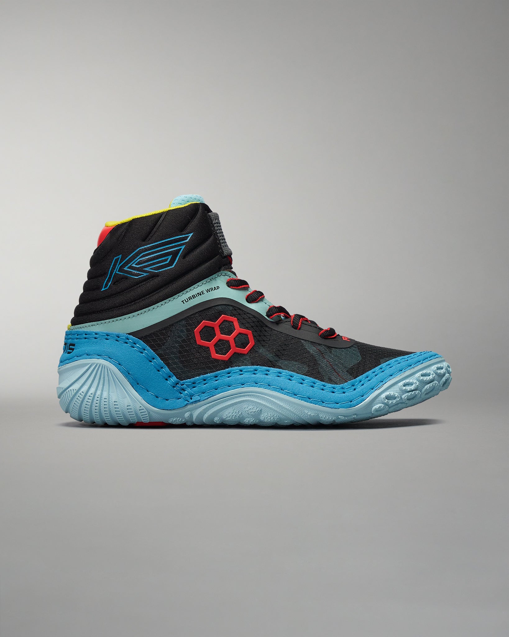 A modern black high-top athletic shoe with vibrant blue and red accents designed for performance and style