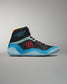 A modern black high-top athletic shoe with vibrant blue and red accents designed for performance and style