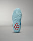 This image displays the sole of a blue athletic shoe featuring a unique red hexagonal design showcasing its textured surface for enhanced grip and performance