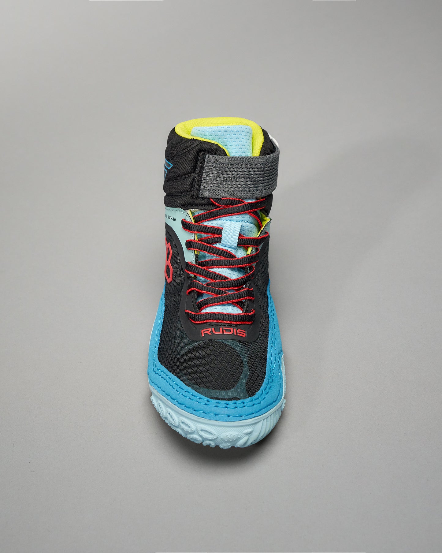 A sporty black shoe featuring bright blue and red accents designed for athletic performance and comfort