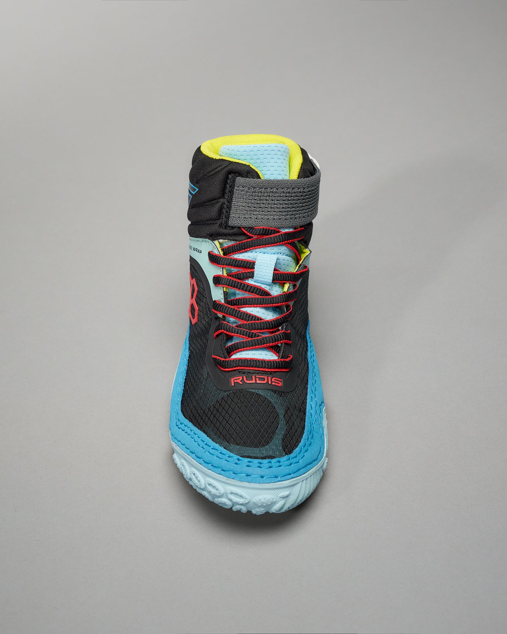 A sporty black shoe featuring bright blue and red accents designed for athletic performance and comfort