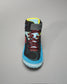 A sporty black shoe featuring bright blue and red accents designed for athletic performance and comfort