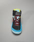 A sporty black shoe featuring bright blue and red accents designed for athletic performance and comfort