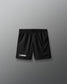 Black lacrosse shorts on a gray background