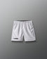White lacrosse shorts on a gray background